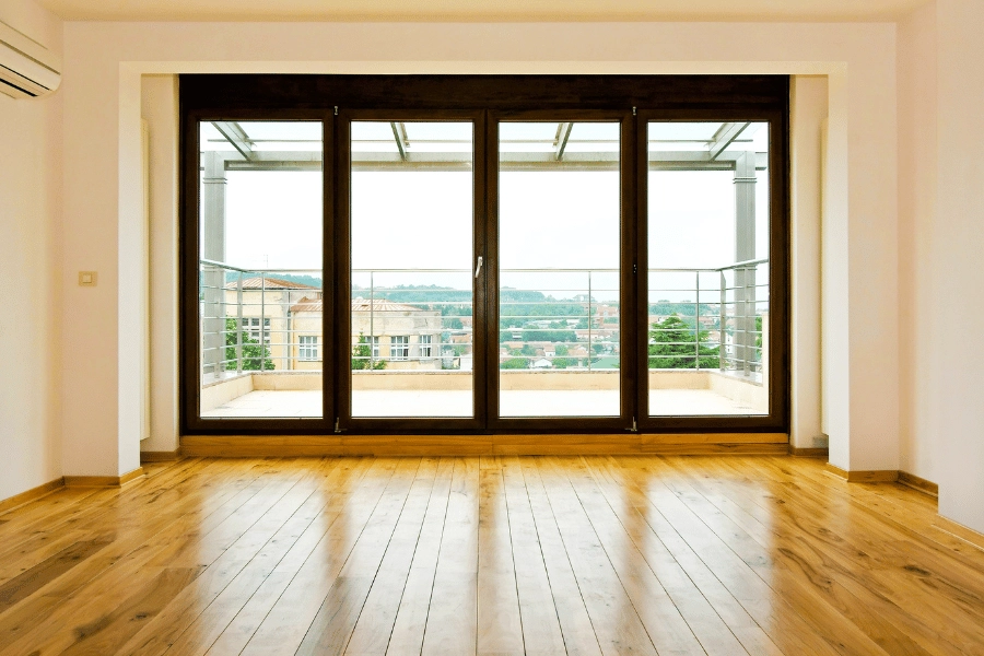 glass doors opening up to outdoor balcony at home